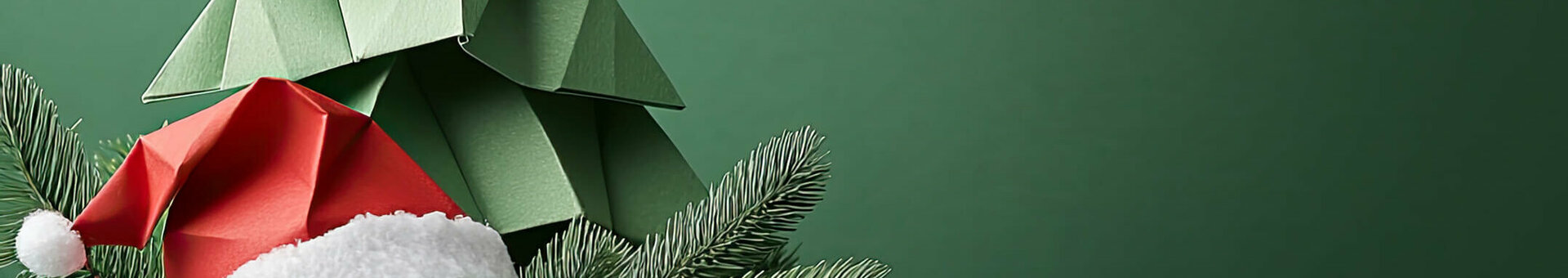 Paper Christmas tree and Santa hat on a green background, decorated with fir branches and red berries.