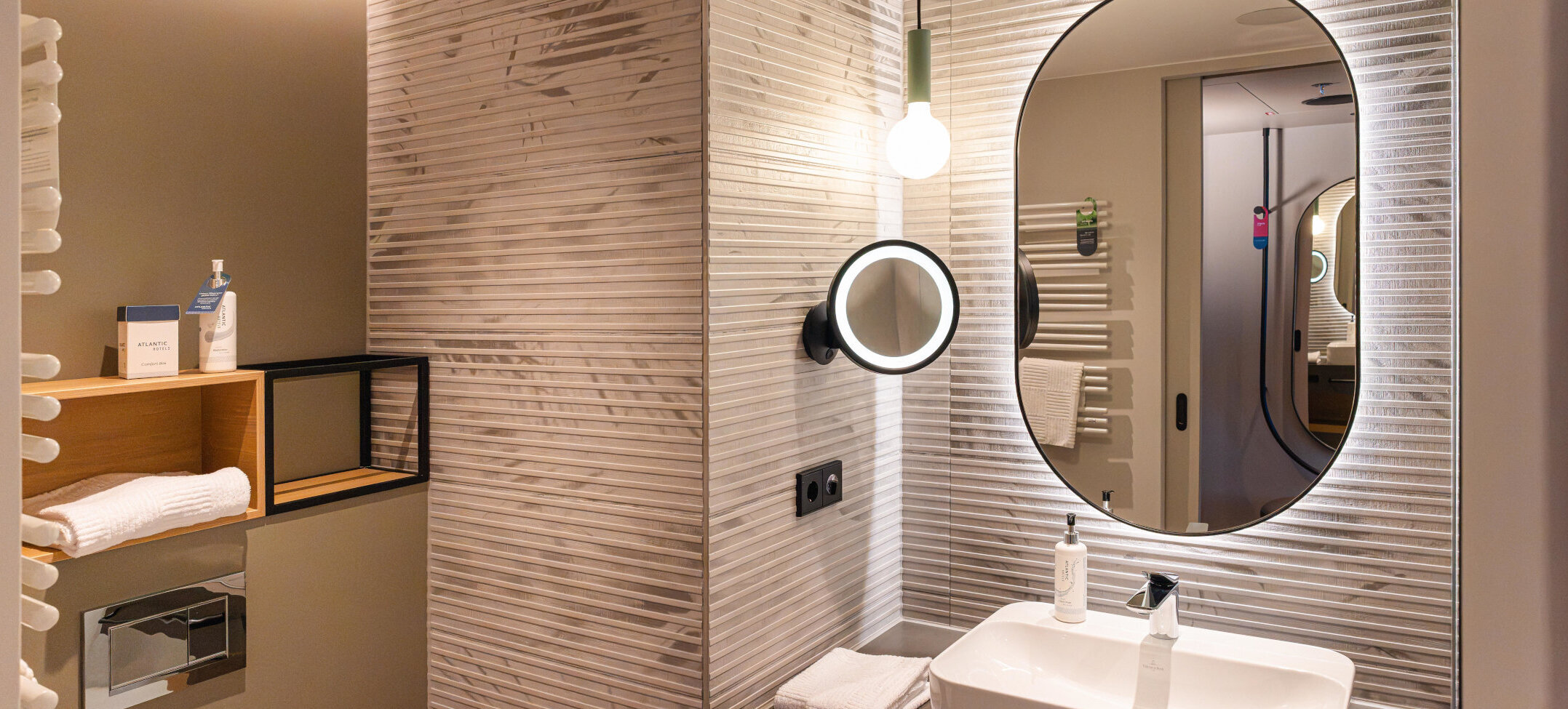 The mirror and washbasin in the bathroom.