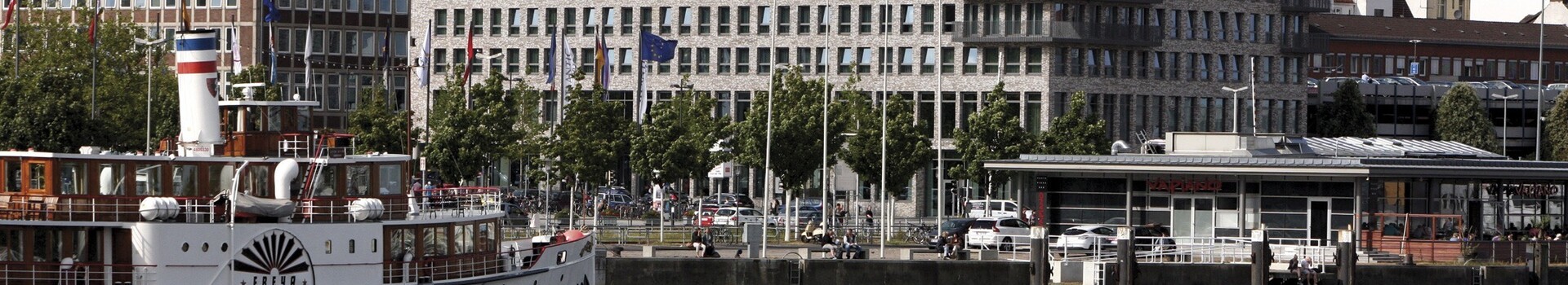 Directly at the Kiel Fjord - exterior view of the ATLANTIC Hotel Kiel at daytime