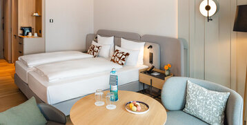 A view of the bed and the seating area in the Superior Double Room.