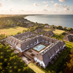 Terrain top view of the grounds of the Hotel Severin*s Resort & Spa and the Sylt coast by drone