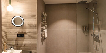 A large rain shower in the bathroom.