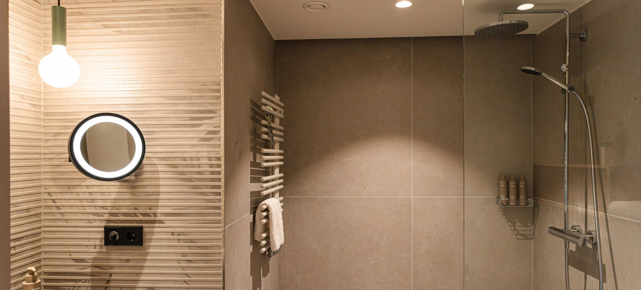 A large rain shower in the bathroom.