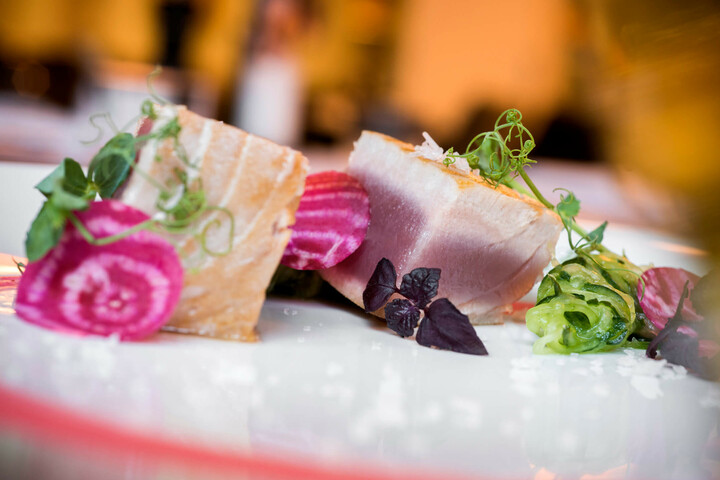 Gourmet plate with tuna, beet, zucchinis and edible flowers, served in style at the ATLANTIC Hotel Lübeck.