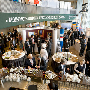 Business meeting at the ATLANTIC Hotel Sail City, Bremerhaven, with guests and catering in a modern conference room.