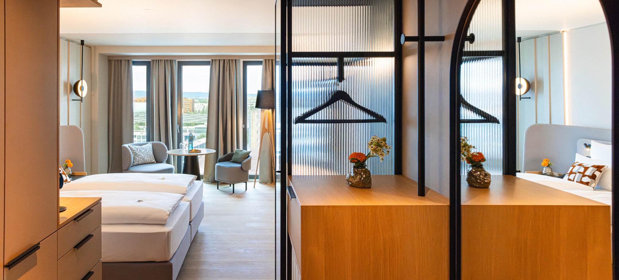 A view of the room with modern furniture and wooden accents.