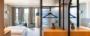 A view of the room with modern furniture and wooden accents.