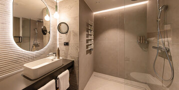 A floor-level rain shower in a modern bathroom.