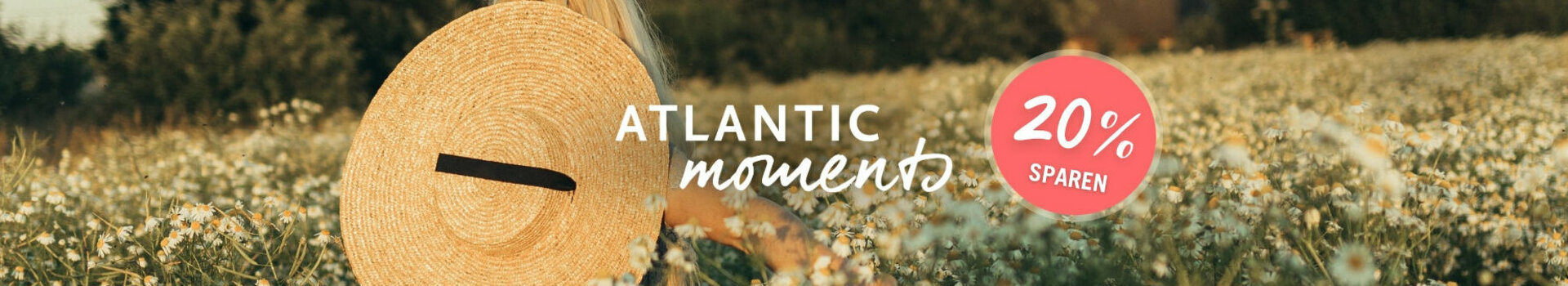 ATLANTIC Hotels Vorteilspreis | Moments Frau mit Strohhut in Blumenfeld, Text "Atlantic Moments" und "20% sparen" auf rotem Kreis.