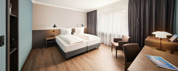 Room with double bed at the ATLANTIC Hotel Landgut Horn