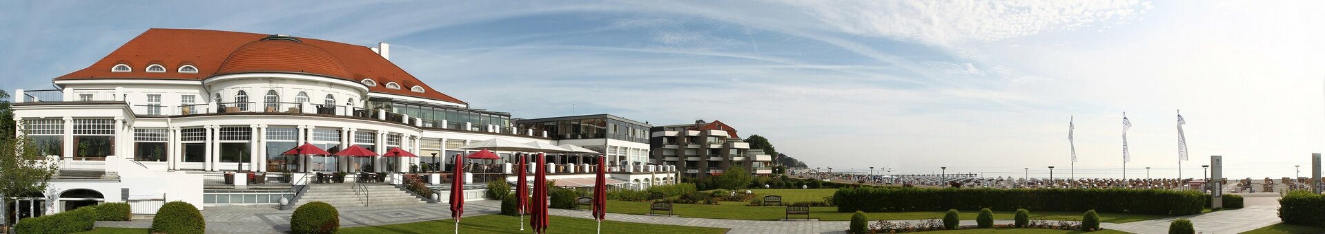 ATLANTIC Grand Hotel Travemünde exterior view and park The ATLANTIC Grand Hotel Travemünde with its well-kept garden, terrace and view of the Baltic Sea.