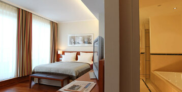 Schlafzimmer im Executive Zimmer des ATLANTIC Hotel Wilhelmshaven