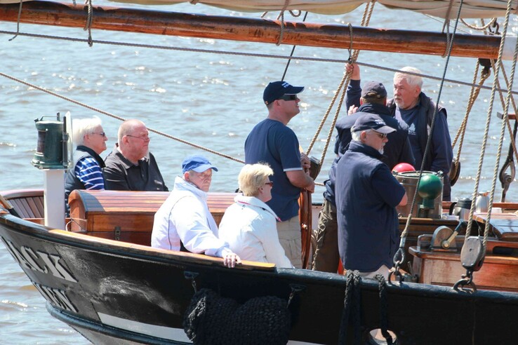 Group of people on a sailing boat on the Weser, sunny day, maritime atmosphere.